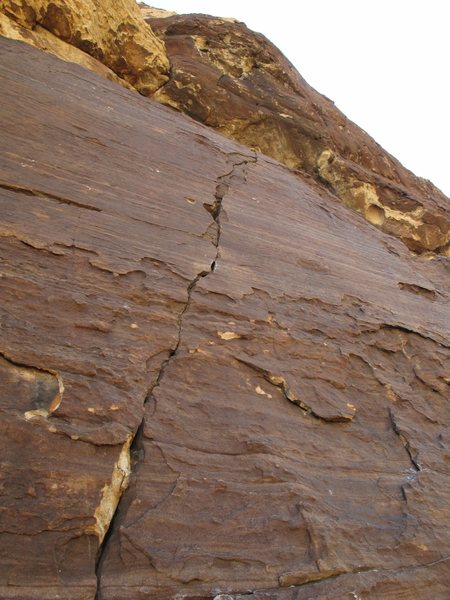 Pitch 10: a crack leads to a roof. This is the crux pitch of the upper route.