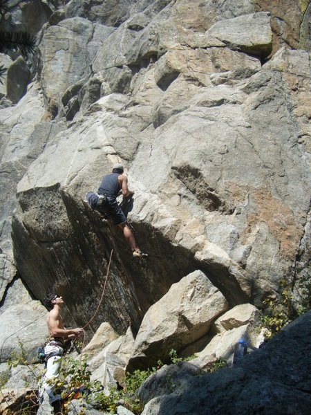 Mike B pulling the crux on Stroke of Midnight.