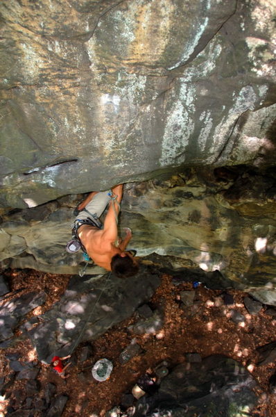 Jeremy Steck resting after the crux moves during the first ascent of Prince of Darkness 12c Ohiopyle State Park, PA