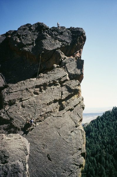 Climbers Kat and Ryan on Lepracaun Promenade (10b), on the summit of the Fiddle Head in Fern Canyon.