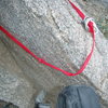 Temple Crag rappel anchor- Why you should always check the entire rappel sling.  This sling was otherwise new, but the pinch at the back was sharp and severed the webbing.