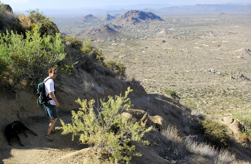 Rick descending the Tom's Thumb trail.  The closest house down the steep hill is near the entrance to the wash and old parking area.  That entry is closed and considered critical wildlife habitat.  
