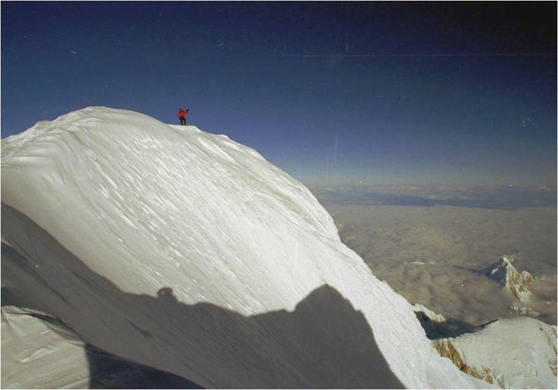 On the summit. I think that's Mt. Huntington on the lower right.