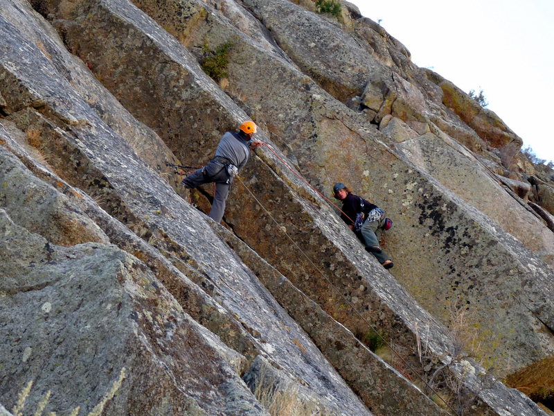 Heading up the big left-facing corner just after the short downclimb from the belay and into the corner. October 2009.