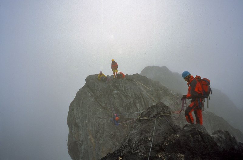 Climbing along the misty ridge.