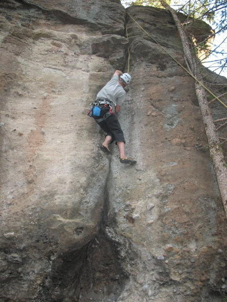 Hand Over Fist - the dark spot at the bottom is a cave that quickly leads to the crack. Back up the bolts on top!