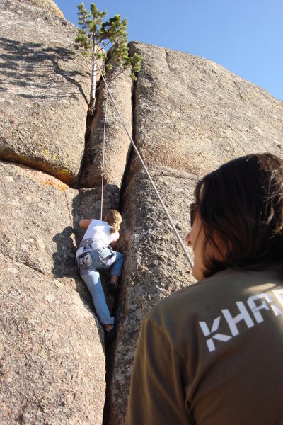 Ila in second pitch of Le Petit Arbre. The tree is not a rope hazard as this photo makes it seem.