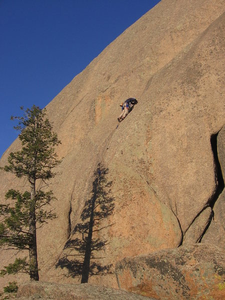 Luke Clarke above the bolts on the quality alternate start to Fool's Gold. Easily protected cracks lead to three bolts where the route joins the traditional line. (The offwidth start to Face Value is in lower right.) Photo by Lenny Miller.