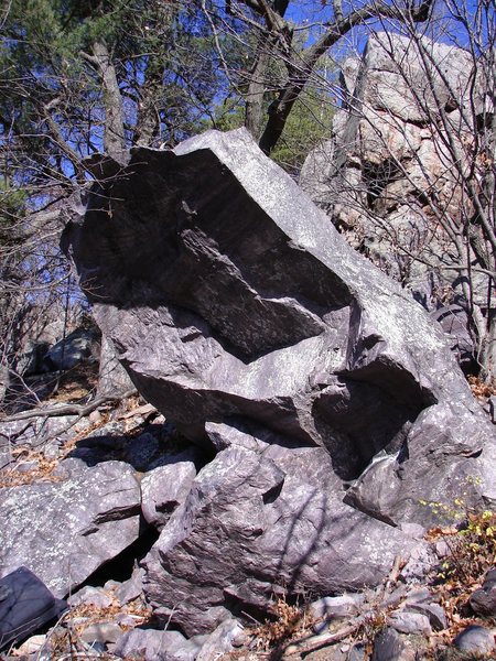 The Wave Rider goes up left side of boulder.