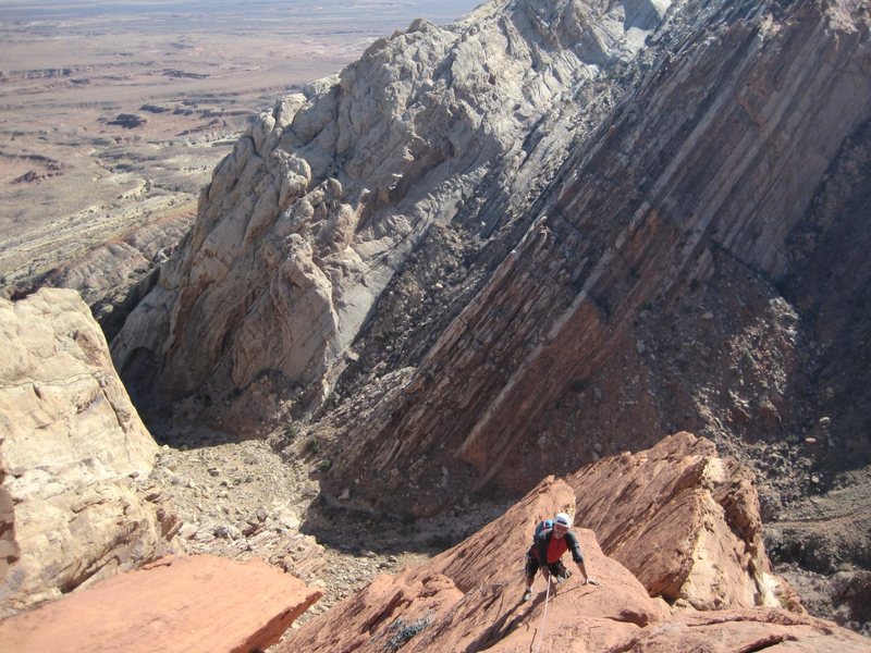 Paul following the final pitch ..way above the entrance of Three Fingers Canyon