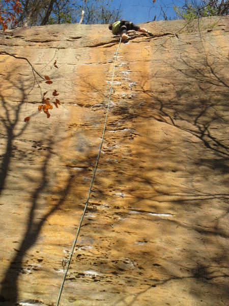 Beginning the final thin boulder problem below the anchor.