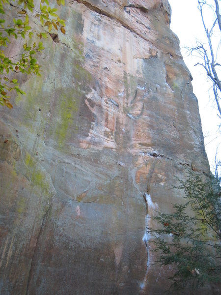 Super Slab. Begin up the heavily chalked L-facing dihedral, and snake your way up towards the right-facing, right-leaning dihedral at the top.