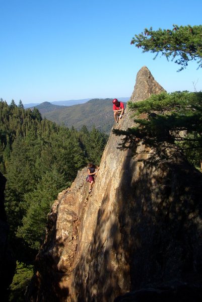 Brett Hayes cleaning Shattered Slab 5.10a. Photo by Stephen Benner.