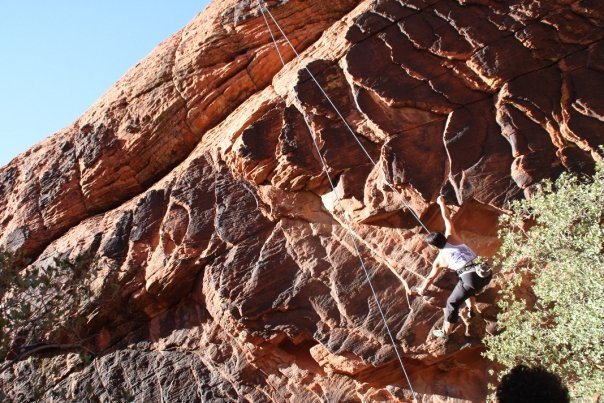Moving to the overhanging rock edges on 'The Boila' at New Castle Crag.