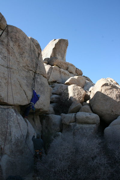 Al working the left crack on a wall behind Headstone rock