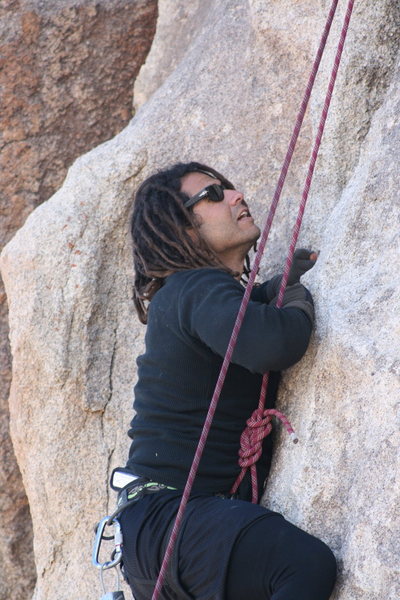Roger starting the left crack on the wall behind Headstone rock