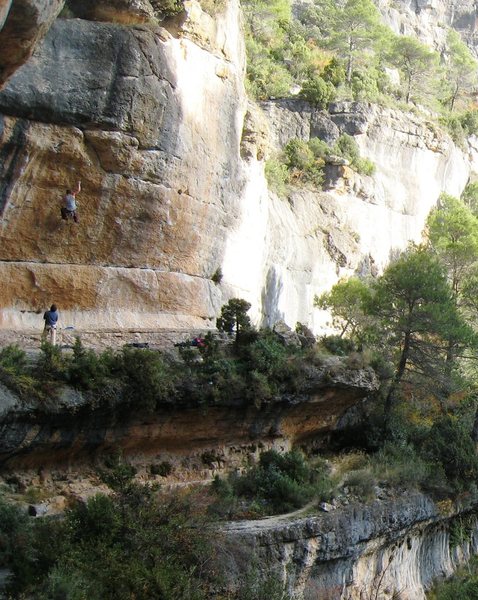 The right side of L'Olla, including the right-half of the central cirque. The climber is on "Tic I Toc", 8a+. The approach trail for the 'Left Side' is visible at the bottom of the pic.