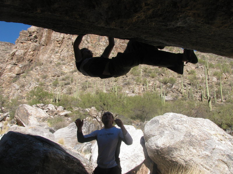 Ian topping out Widowmaker (note: most of the problems on this side of the boulder share this same tricky topout)