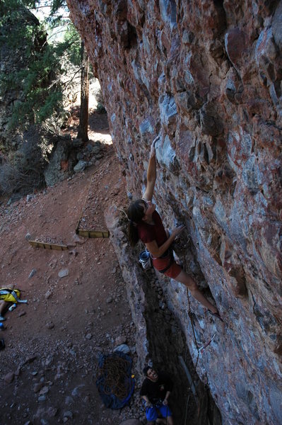 Page making the early crux moves on Against All Cobbs.