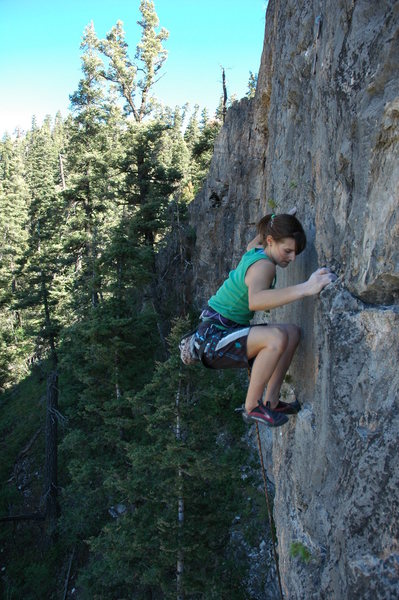 Page finishing off the upper headwall of a 5.12a on the left end of the cliff. Route is, A View to a Kill