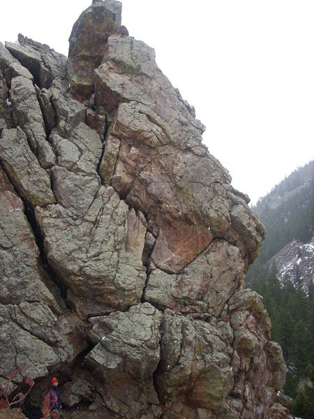Climb through the bulging crack in the center of the photo.