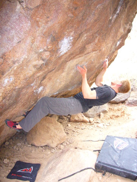 The right-hand pocket V5 warm-up at the Silverbell boulders in Tucson, AZ