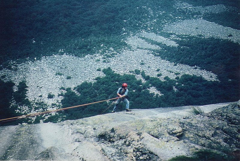 The first traverse of Cannon .The Magical Mystery Tour AUG 1973 .Paul Ross on the rap pendulum to reach the flake on the Labyrinth wall. The first traverse took Ross and Barber a few minutes under 6 hours.The lenth of the traverse is about 6000'