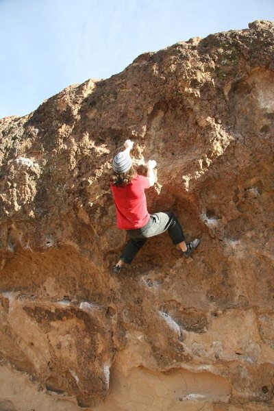 Setting up for the crux on Local Boy Does Good, V4