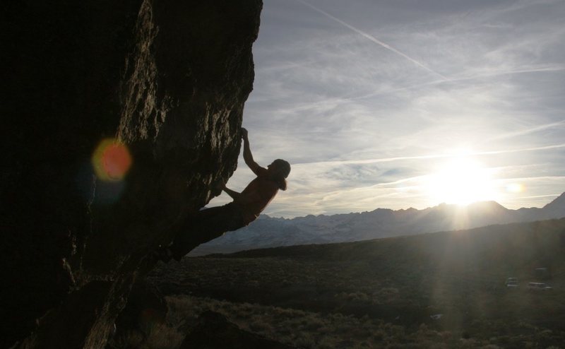 Making the crux pull to the horn on The Snapper, V5