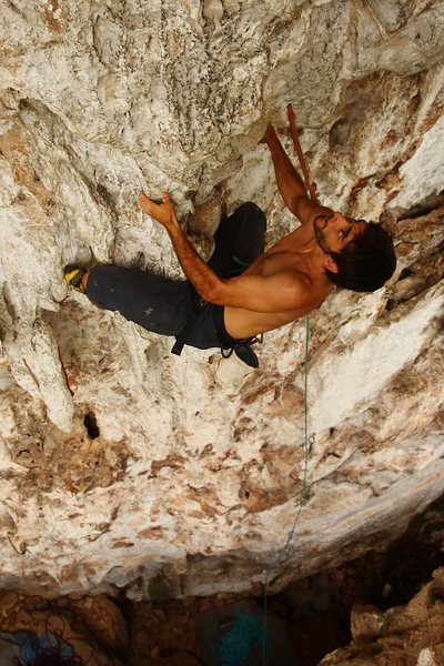 Saul on the finishing bulge - Thanks Josh (5.10d). Vang Vieng, Laos