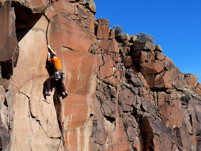 A beautiful crack offers up painful off-fingers in the crux. January 2010.