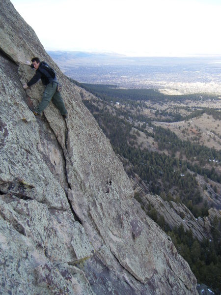 Downclimbing back to the "elbow" on Seal Rock.