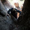 Hanna entering the Shmotem Hole after pausing to search for raptors. No, that's not slack in the rope, btw!
