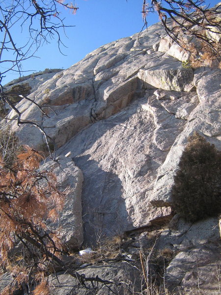 Black Dog climbs through the overlaps on the left side of the arch; the roof on the right goes at 10a.  The runout slab crux is just visible a bit past the second roof. 