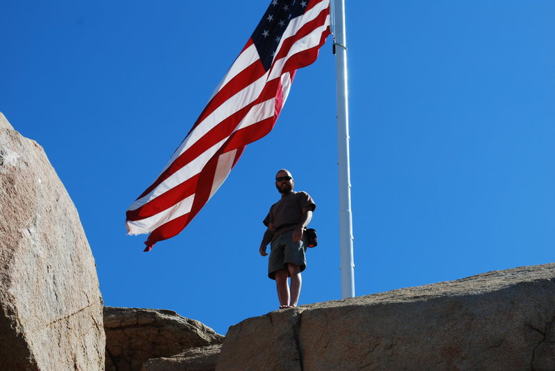 Nate bouldering up near the flag on Mt. Rubidoux 2-28-10
