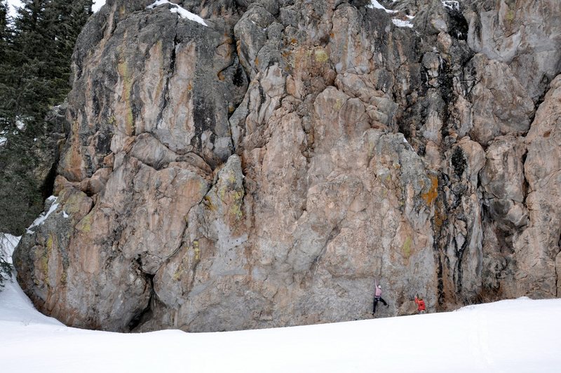 Working into the crux of Mr. Dubious. March 2010. It looks like she's barely off the ground but the snow was drifted up about four feet high but a small trough at the wall's base was snow-free.