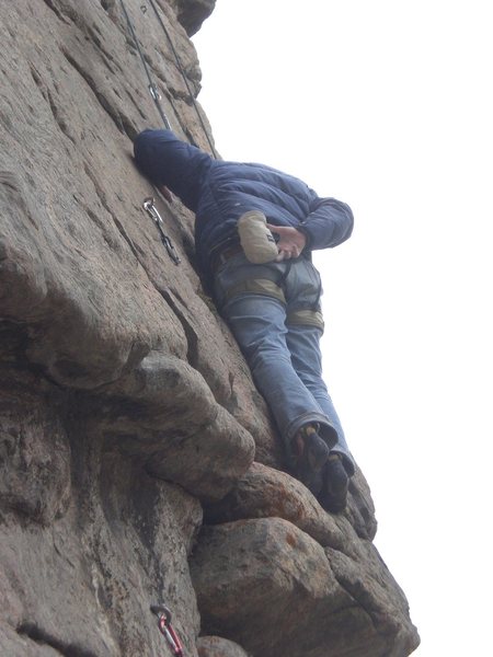 Luke on the slab after the crux.