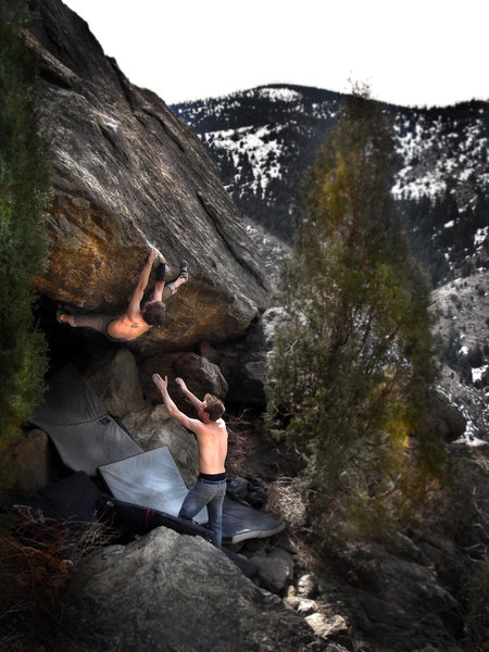 Jason Baker squeezing and pulling to gain the final exit (crux) moves on "Stanley Kubrick (V11)." <br>
<br>
Spotter: Tom<br>
<br>
Photo by: Luke Childers