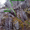The dotted line is an easy but potentially sketchy scramble up to the base of the route...