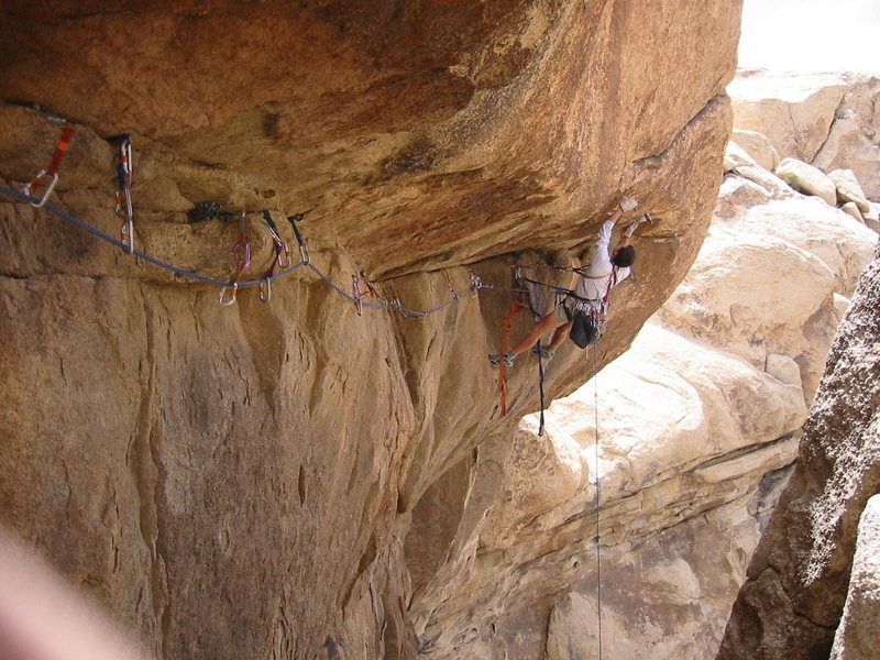 Frazier Haney on the first ascent at the roof on Jesus Saw You Take It.