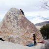 Climbing on Wedge Boulder, 'Right Arete' V0- in Joshua Tree. Nice little warm up.