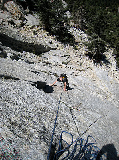 Jascha after the first 5.9 crux, pulling an overlap with a thin finger crack