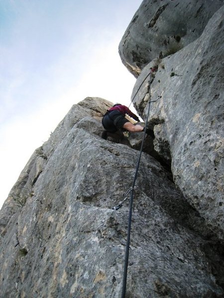 The p girl climbs back up to the last up climb on the traverse of Les Trois Pucelle