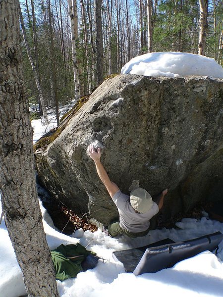 Todd Helgeson warming-up on In the Trench V3, at the Frostbite Boulders, AK.