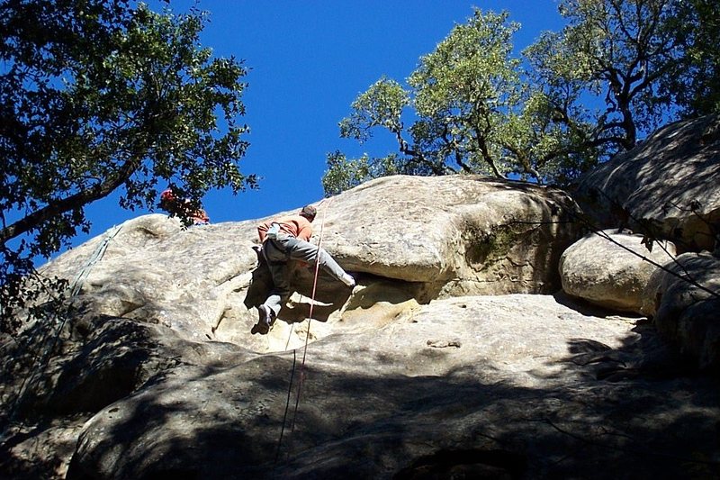Paul doing the crux move thru the roof of Putrefaction. November 2004