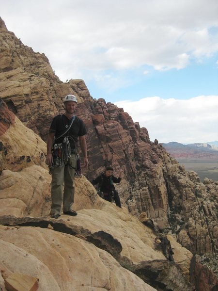 Nothing beats a fun day out with friends on a long route in Red Rock.<br>
<br>
Jason in foreground with Anne coming around the bend.<br>
<br>
5/2010.