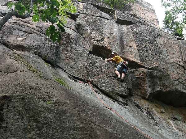 Adirondack Guidebook Author Jeremy Haas escapes the initial slab and begins the steep headwall portion of Recuperation Boulevard.