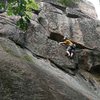 Adirondack Guidebook Author Jeremy Haas escapes the initial slab and begins the steep headwall portion of Recuperation Boulevard.