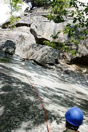 Alex reaches the belay anchor for Recuperation Boulevard. Note the 20' initial slab followed by 25' of steep, featured face.