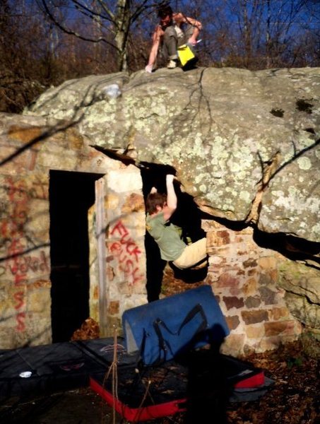 Adam Walker on "DoorWay" (V-4+) at the roadside boulder, bluefield boulders.<br>